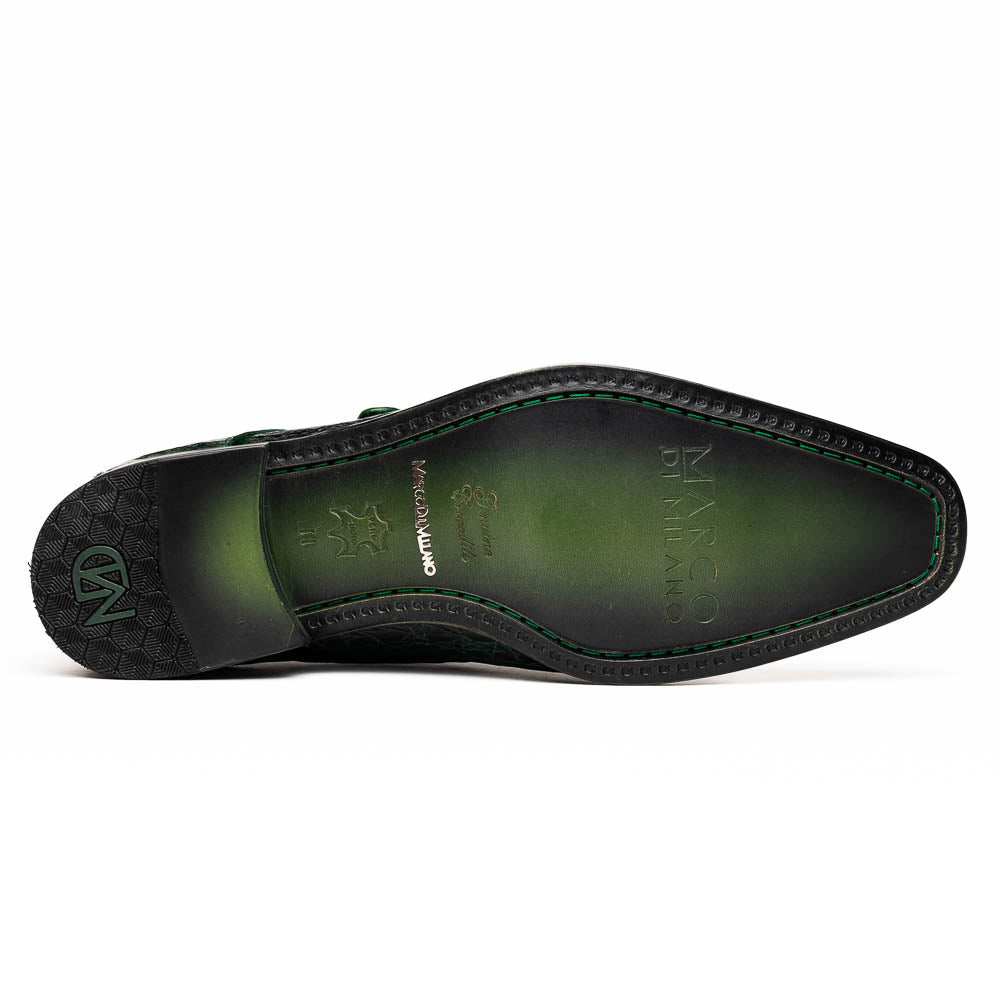 The Marco Di Milano Rovigo Forest Green features genuine caiman crocodile leather and a luxury monk strap, with one dress shoe propped to reveal its sole—a bold statement among men's exotic dress shoes.