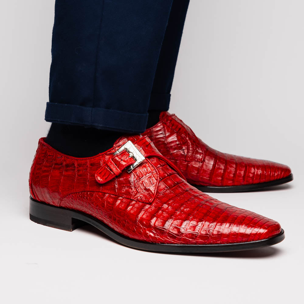 A pair of luxury Marco Di Milano Rovigo Red men's dress shoes in genuine caiman crocodile leather: one upright, the other on its side revealing the elegant sole.