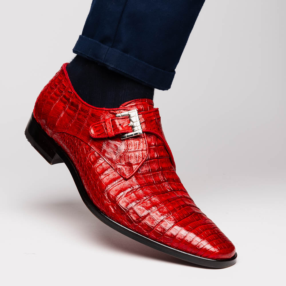 A pair of luxury Marco Di Milano Rovigo Red men's dress shoes in genuine caiman crocodile leather: one upright, the other on its side revealing the elegant sole.