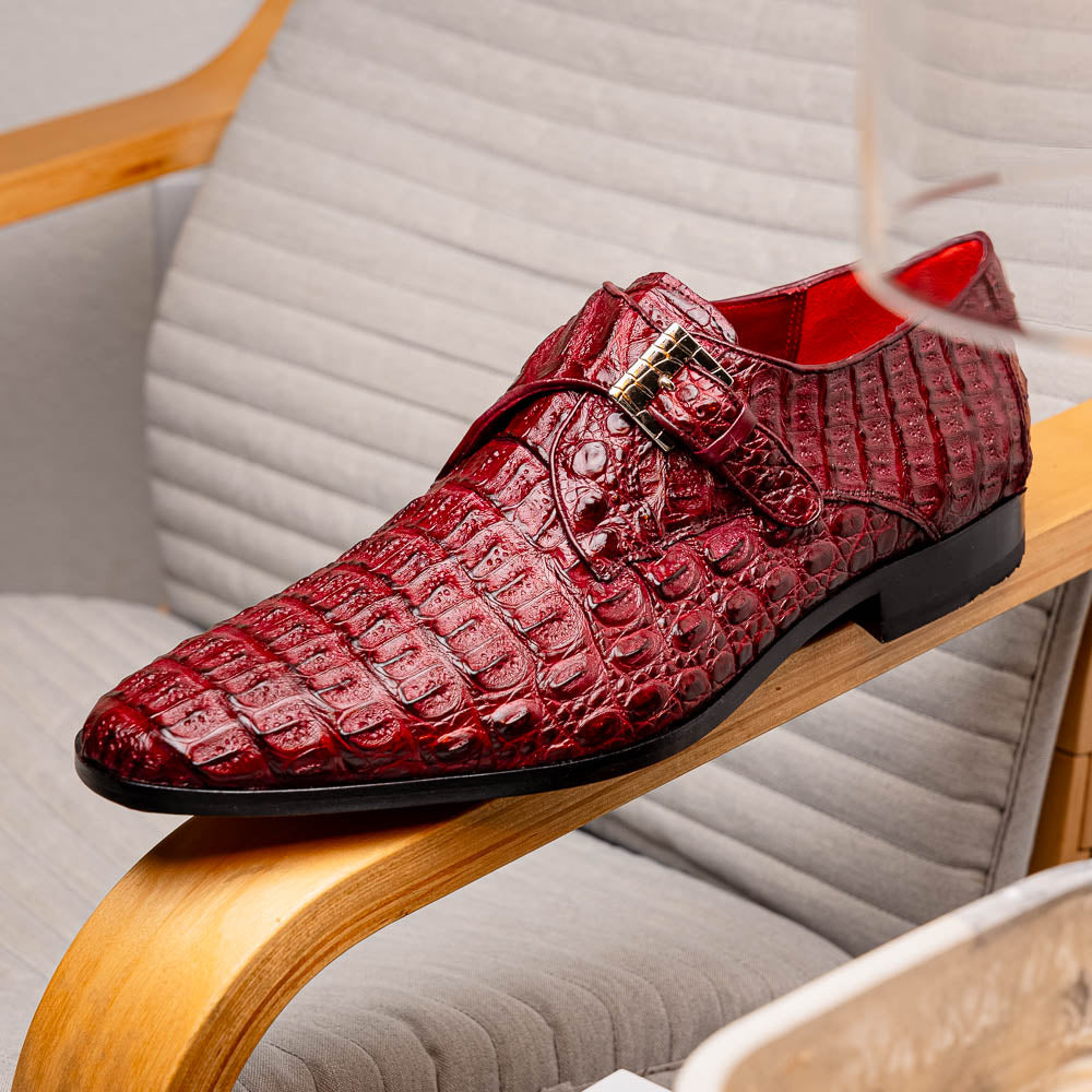 A pair of Luigi Wine monk strap dress shoes by Marco Di Milano, crafted in burgundy crocodile-pattern leather with silver buckles—one shoe displays the sole featuring the Marco Di Milano branding.