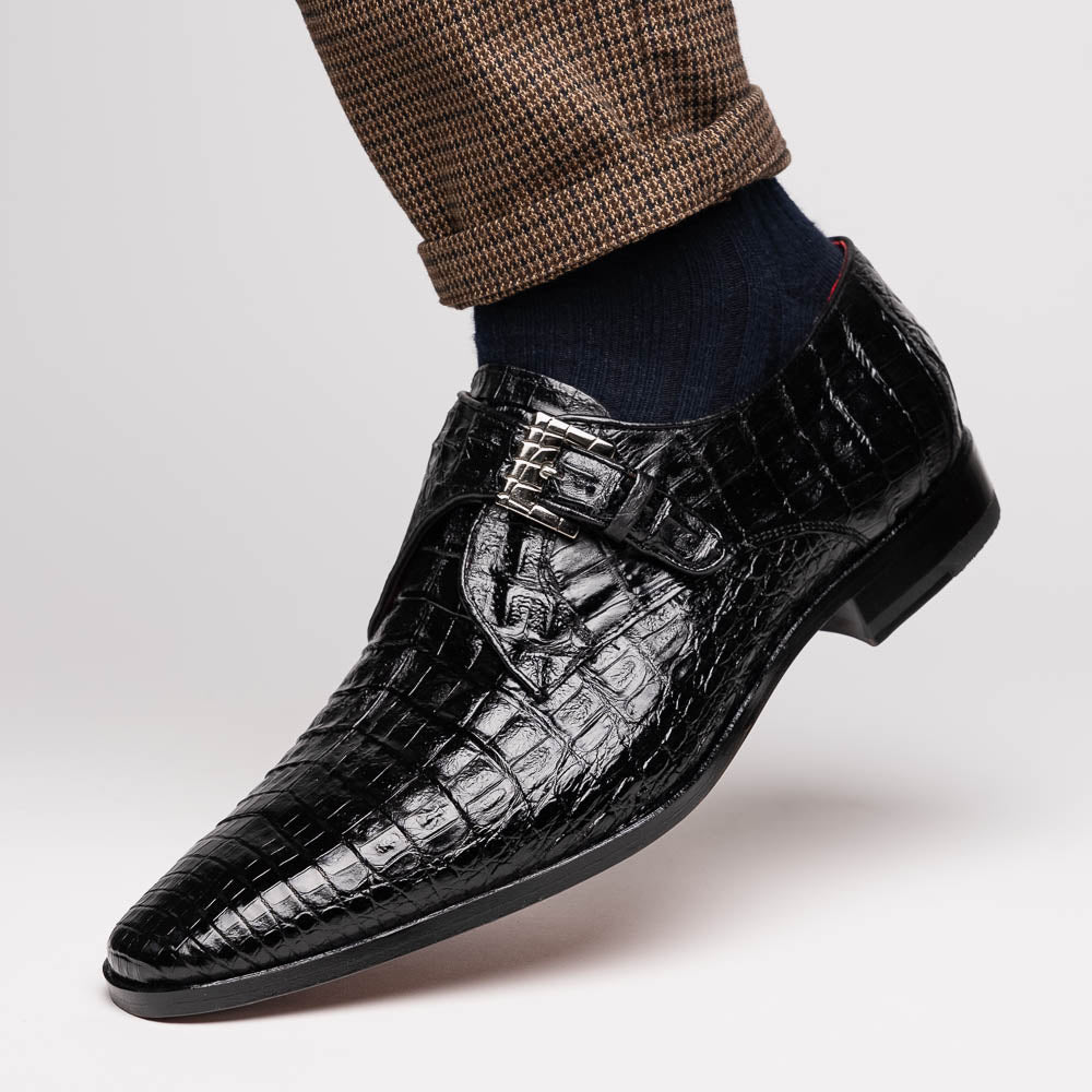 The Marco Di Milano Rovigo Black is a luxury monk strap dress shoe featuring genuine caiman crocodile, a pointed toe, metal buckle, and brown leather sole, displayed on a clean white background.