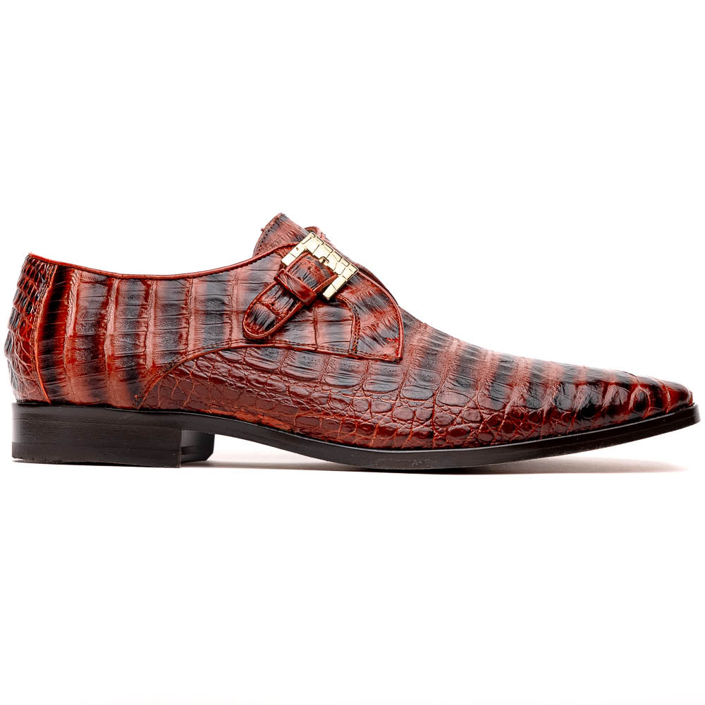 The Rovigo Cognac Straps by Marco Di Milano are brown genuine caiman crocodile monk strap dress shoes with a metal buckle—one upright, one on its side showing the branded sole. Luxury footwear for refined taste.