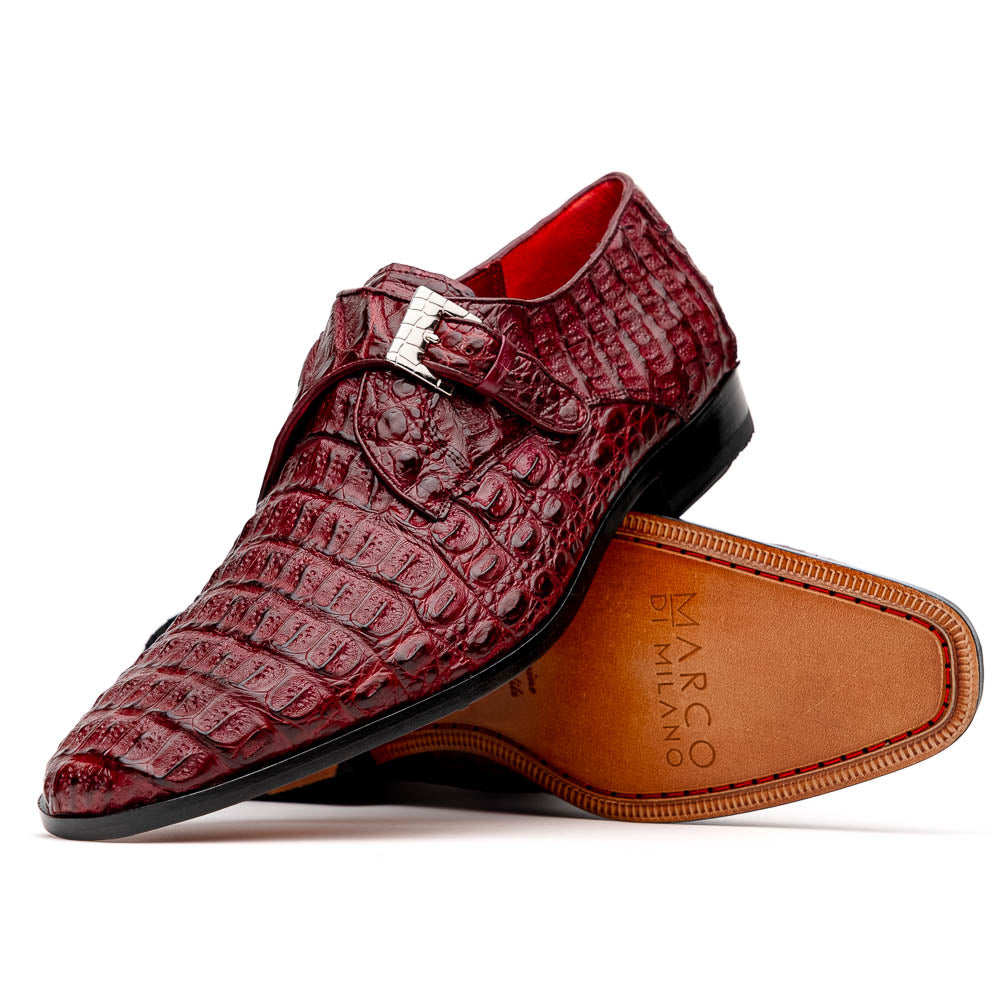 A pair of Luigi Wine monk strap dress shoes by Marco Di Milano, crafted in burgundy crocodile-pattern leather with silver buckles—one shoe displays the sole featuring the Marco Di Milano branding.