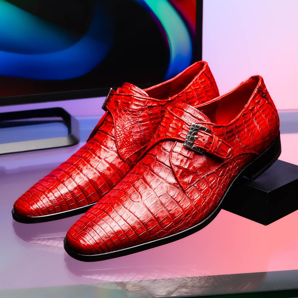 A pair of luxury Marco Di Milano Rovigo Red men's dress shoes in genuine caiman crocodile leather: one upright, the other on its side revealing the elegant sole.