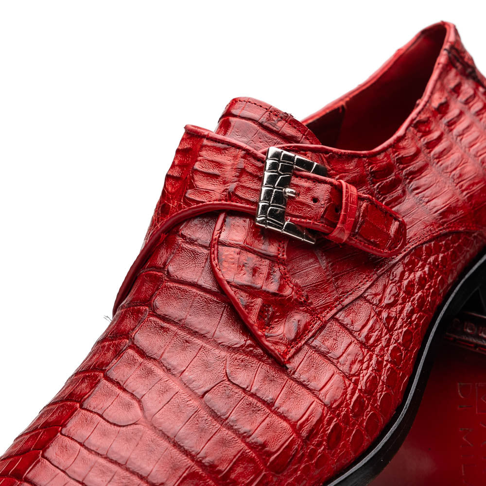 A pair of luxury Marco Di Milano Rovigo Red men's dress shoes in genuine caiman crocodile leather: one upright, the other on its side revealing the elegant sole.