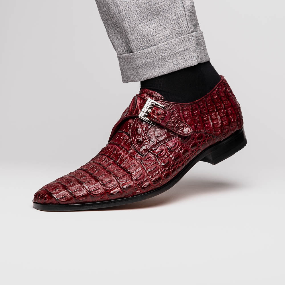 A pair of Luigi Wine monk strap dress shoes by Marco Di Milano, crafted in burgundy crocodile-pattern leather with silver buckles—one shoe displays the sole featuring the Marco Di Milano branding.