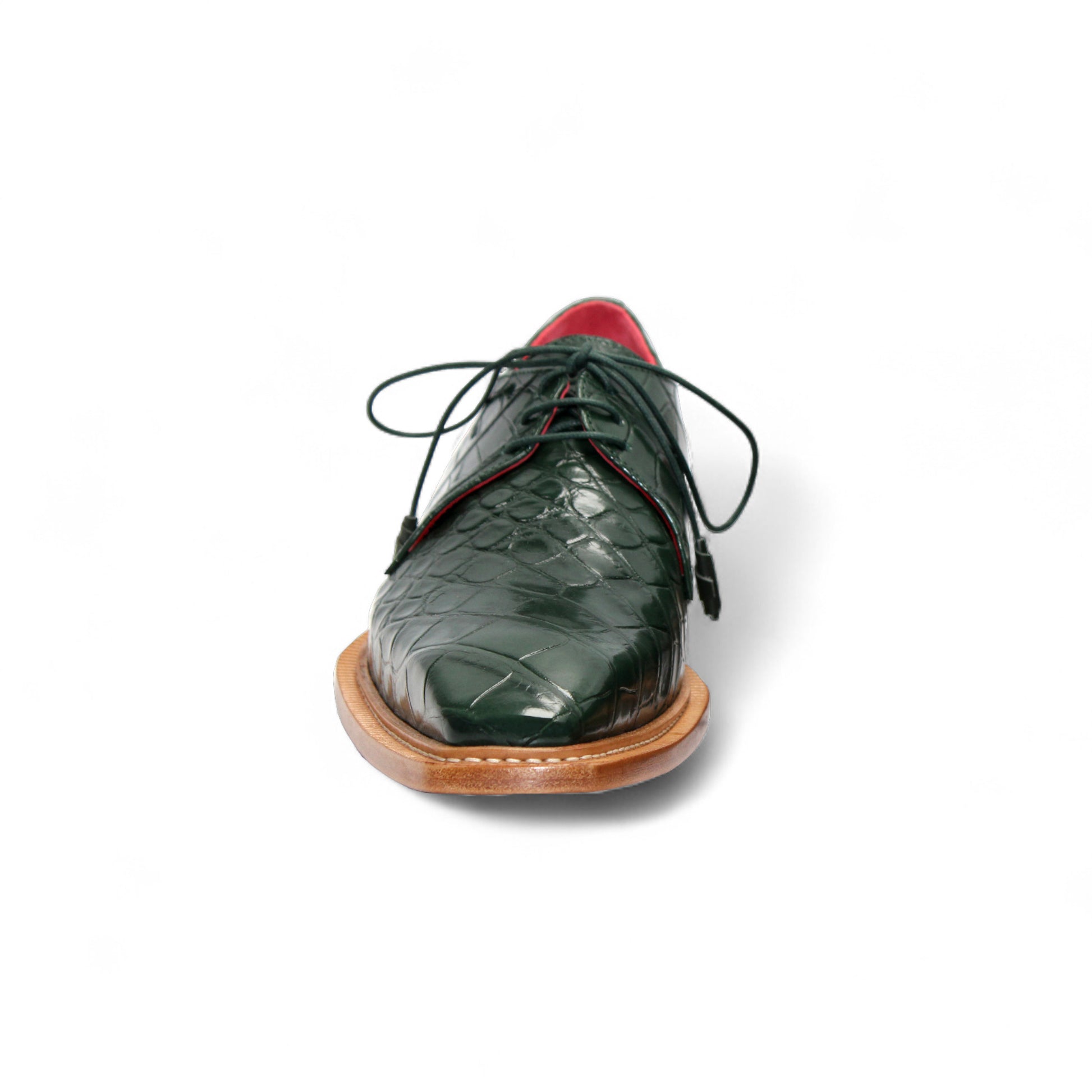 The Fennix Rowan Green by Fennix of Italy is a dark green, crocodile-patterned leather dress shoe with laces, brown sole, and low heel, crafted in Italy and shown from the side on a white background.