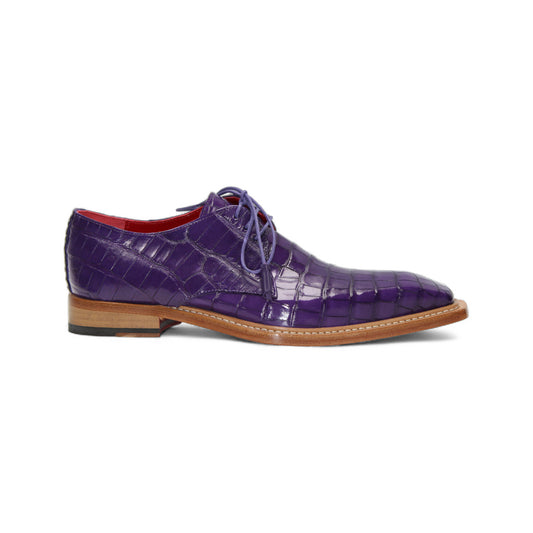 The Fennix Rowan Purple by Fennix of Italy is a luxury purple lace-up dress shoe made from genuine alligator leather, featuring Italian craftsmanship, a brown sole, and a red interior. It's displayed in profile against a white background.