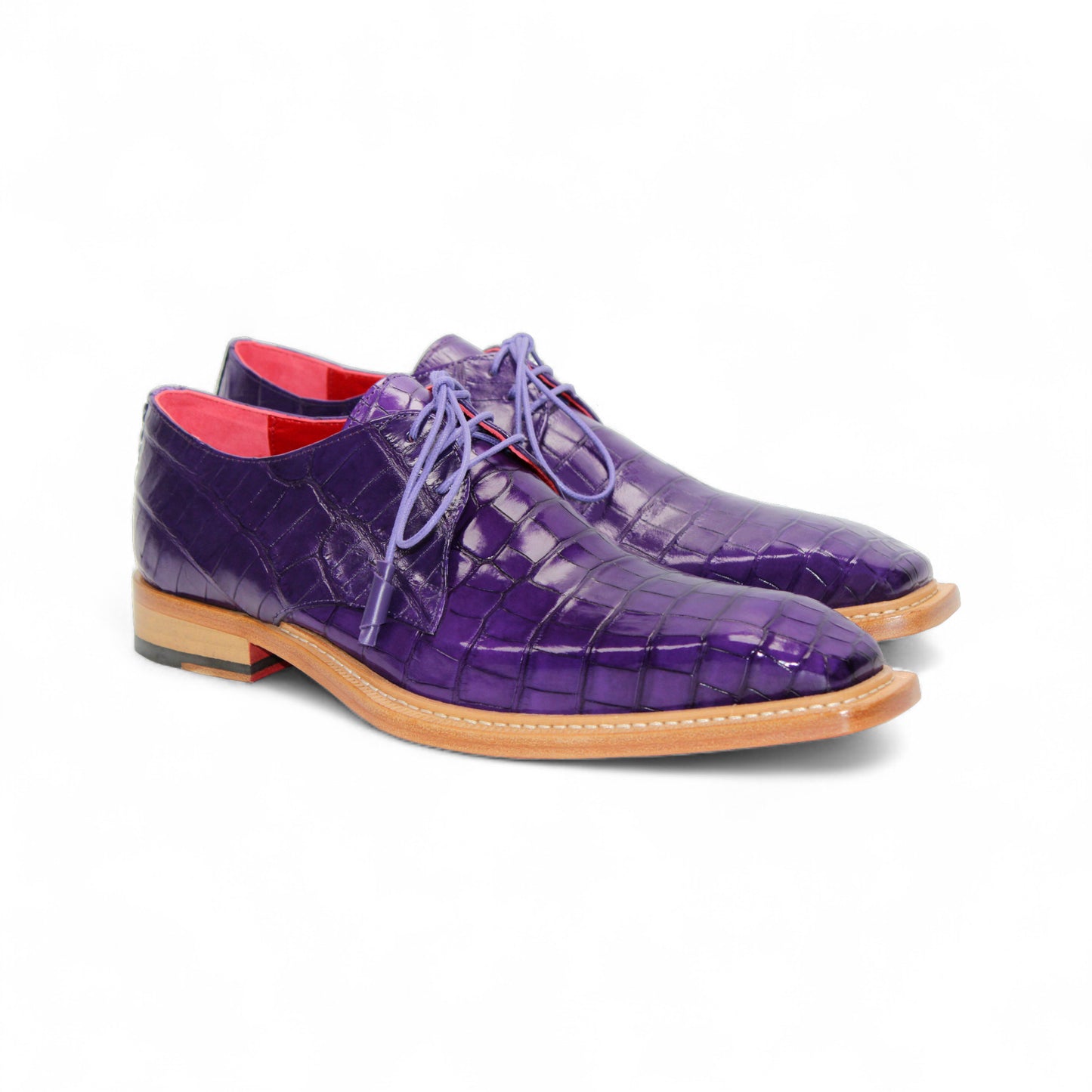 The Fennix Rowan Purple by Fennix of Italy is a luxury purple lace-up dress shoe made from genuine alligator leather, featuring Italian craftsmanship, a brown sole, and a red interior. It's displayed in profile against a white background.
