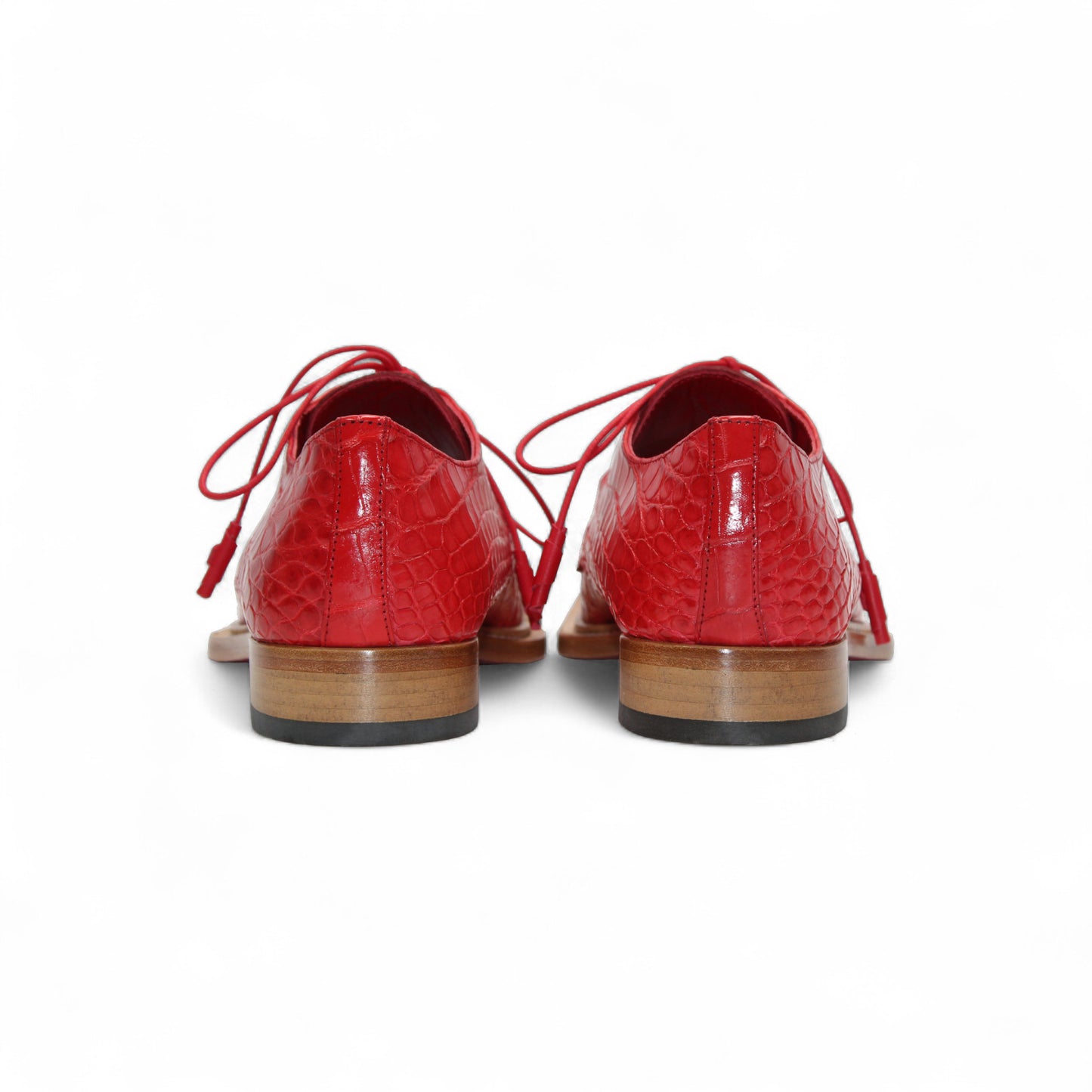 The Fennix Rowan Red by Fennix of Italy—a single red oxford crafted from genuine alligator leather with laces and a light brown wooden sole—is displayed in side profile against a white background, perfect for any luxury shoe collection.