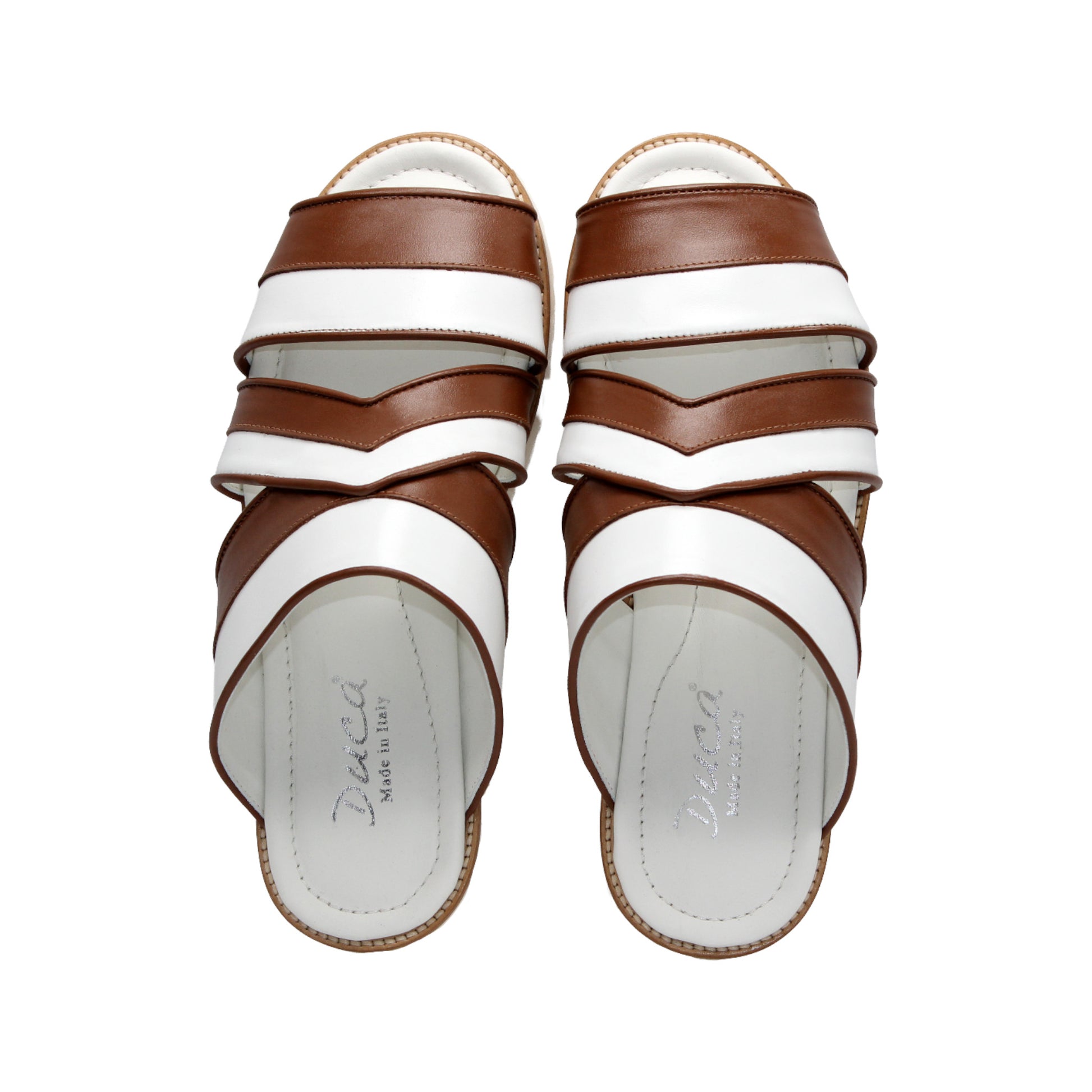 The Duca Di Matiste Duca SA118 Ambra/White is a flat sandal featuring white and brown Italian leather crisscross straps and a white sole—ideal for those who love modern Italian footwear.