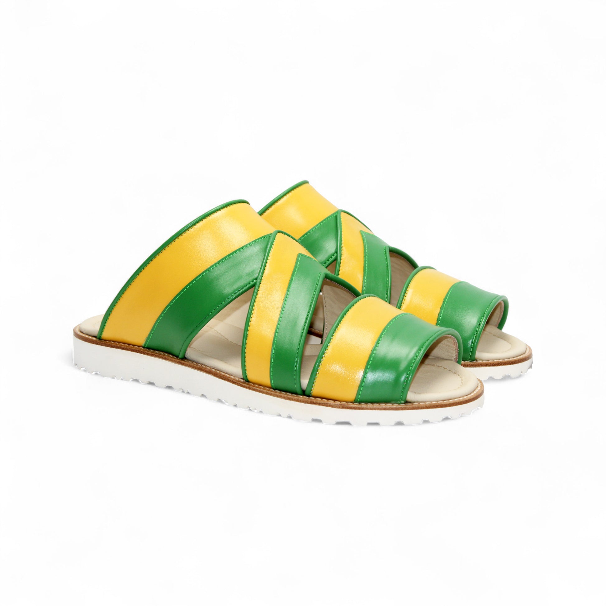 The Duca Di Matiste Duca SA118 Green/Yellow is a flat sandal with green and yellow leather straps and a white ridged sole, inspired by modern Italian footwear and shown in side profile on a plain white background.