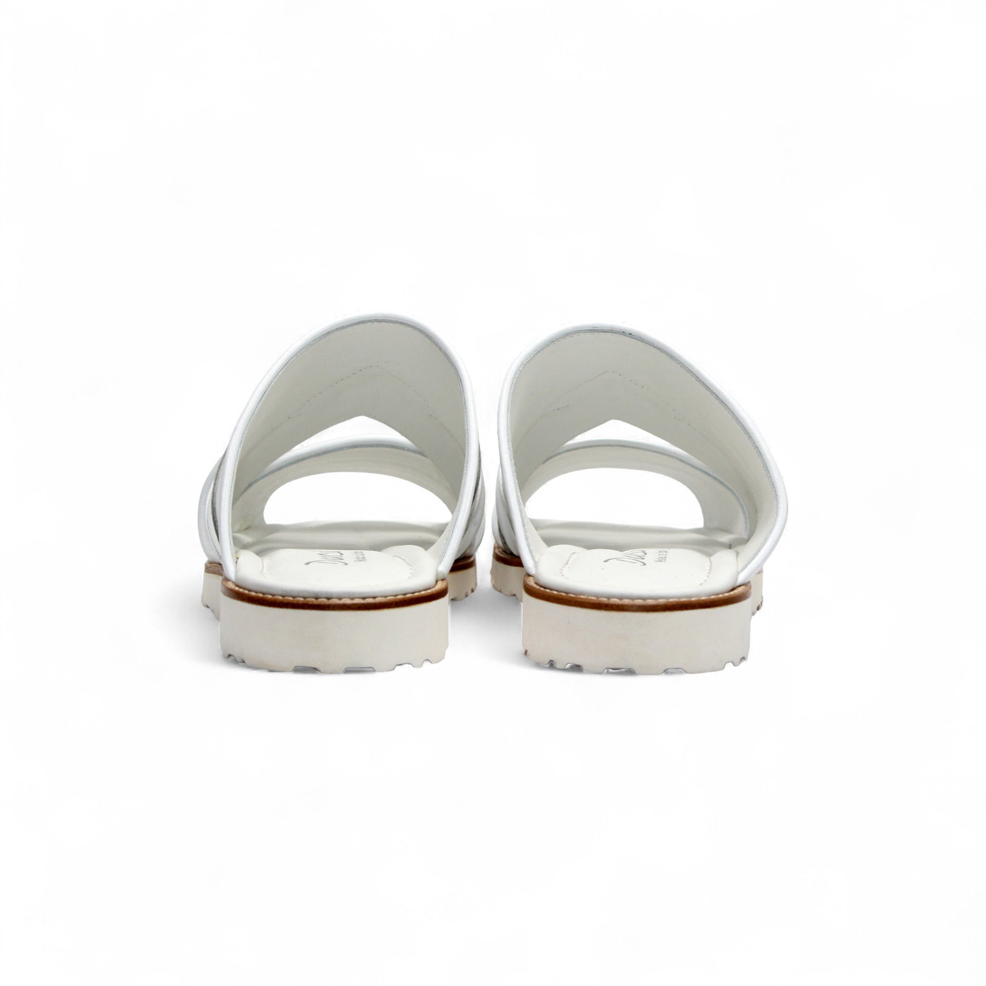 The Duca Di Matiste Duca SA118 White sandal features a modern Italian design with multiple straps, an open toe, flat sole, subtle tread, and effortless style—shown from the side.