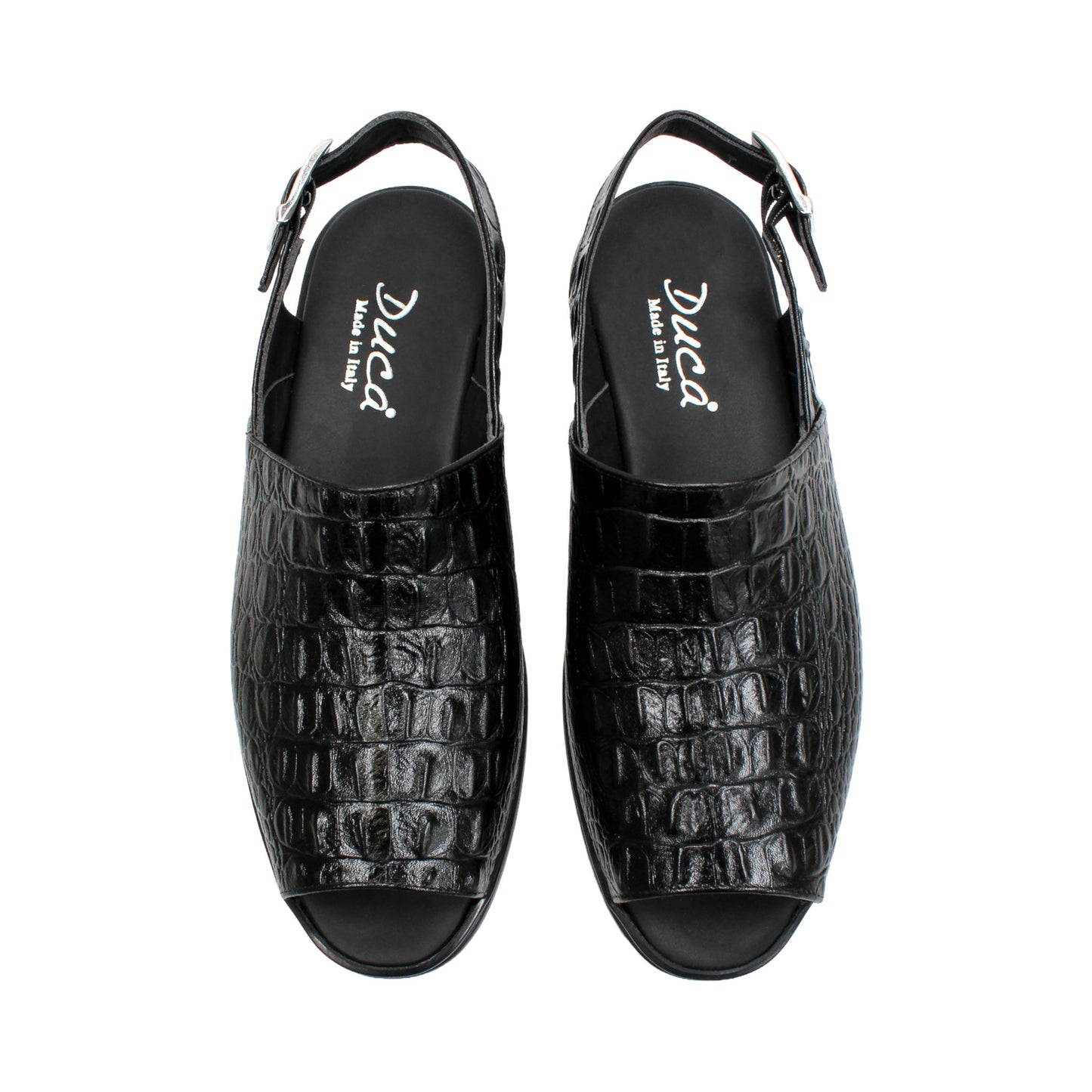 The Duca Di Matiste Duca SA136 Black sandal features faux-crocodile texture, open toe, closed back, adjustable buckle strap, and flat sole. Shown in side view on a white background.