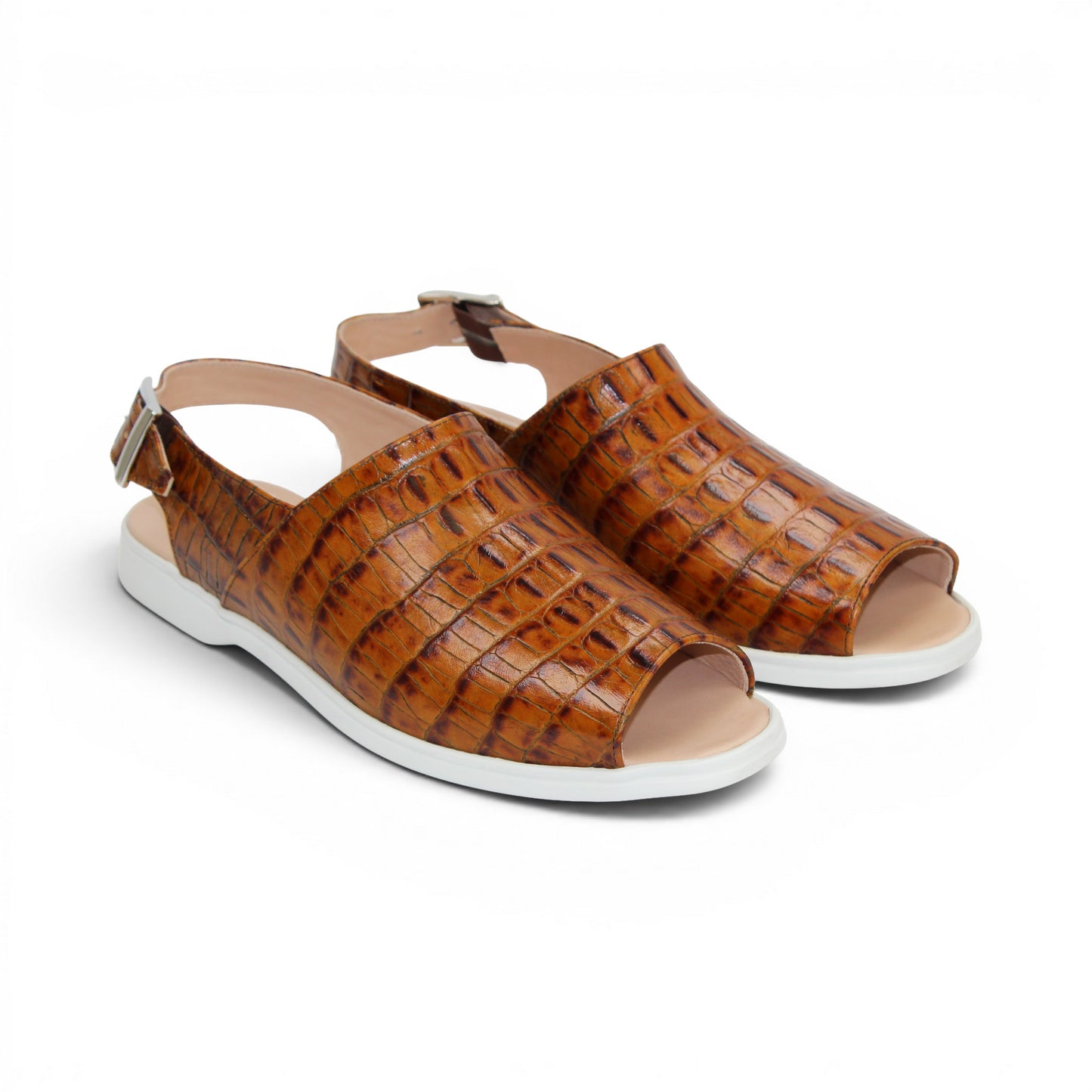 The Duca Di Matiste Duca SA136 Cognac sandal features brown crocodile-patterned calf leather, a closed toe, adjustable buckle strap, and white flat sole for modern comfort, shown on a white background.