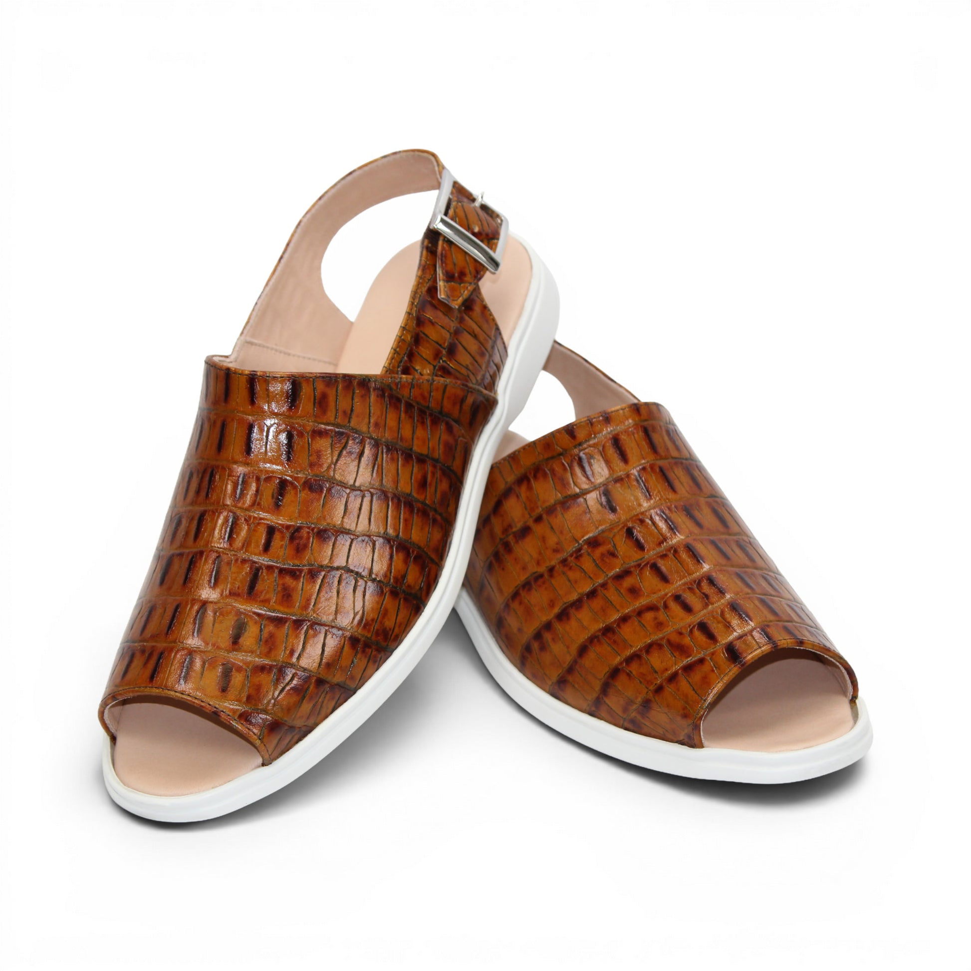 The Duca Di Matiste Duca SA136 Cognac sandal features brown crocodile-patterned calf leather, a closed toe, adjustable buckle strap, and white flat sole for modern comfort, shown on a white background.