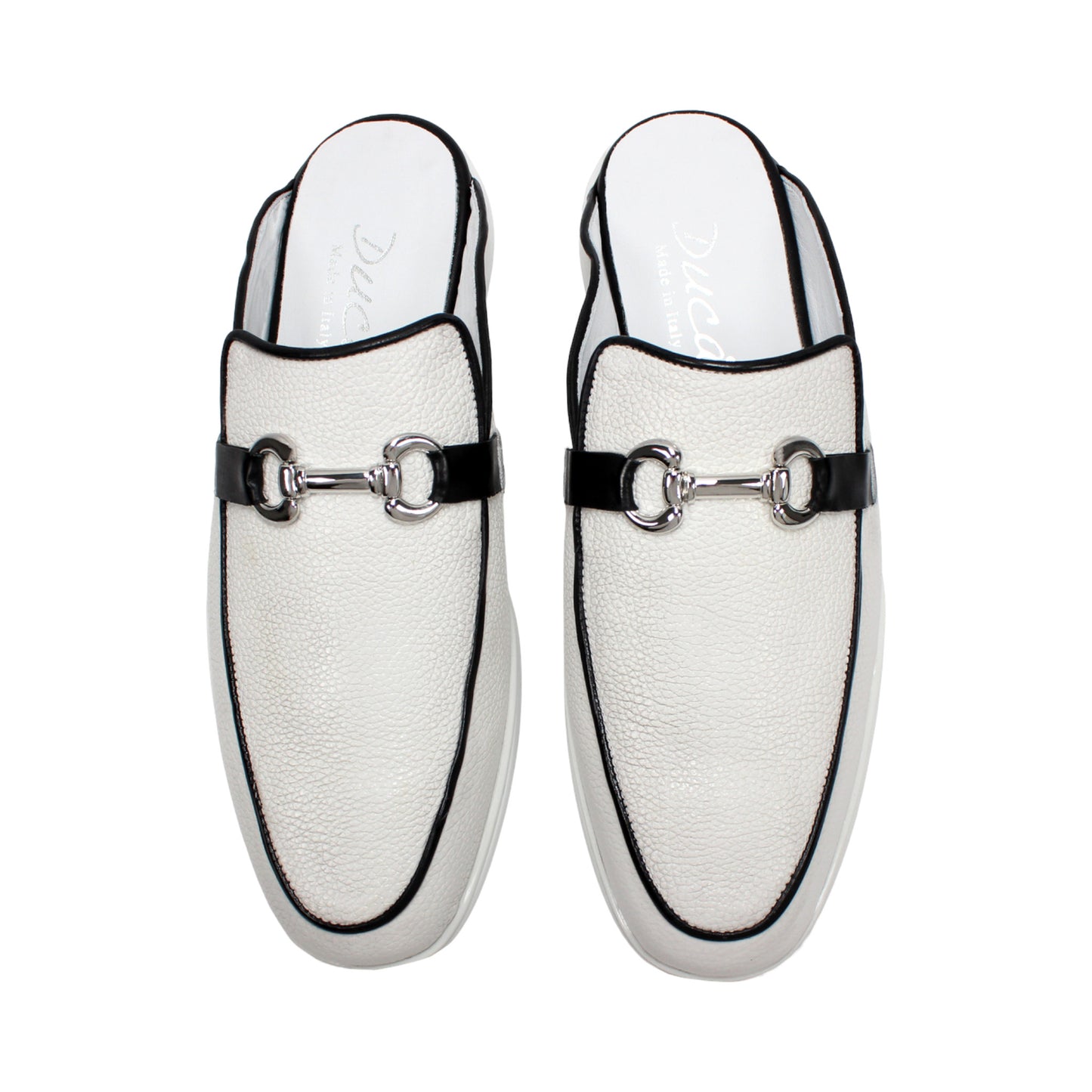 The Duca Di Matiste Duca SA493 White/Black is a white Italian leather slip-on mule with a black trim, low heel, metal buckle, and durable rubber sole, shown in profile against a plain white background.