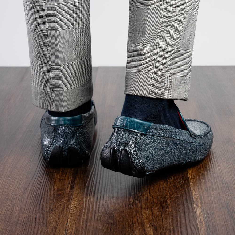 Navy blue textured leather Salermo Navy loafers by Marco Di Milano featuring a silver-tone metal bit across the top and black rubber outsoles.