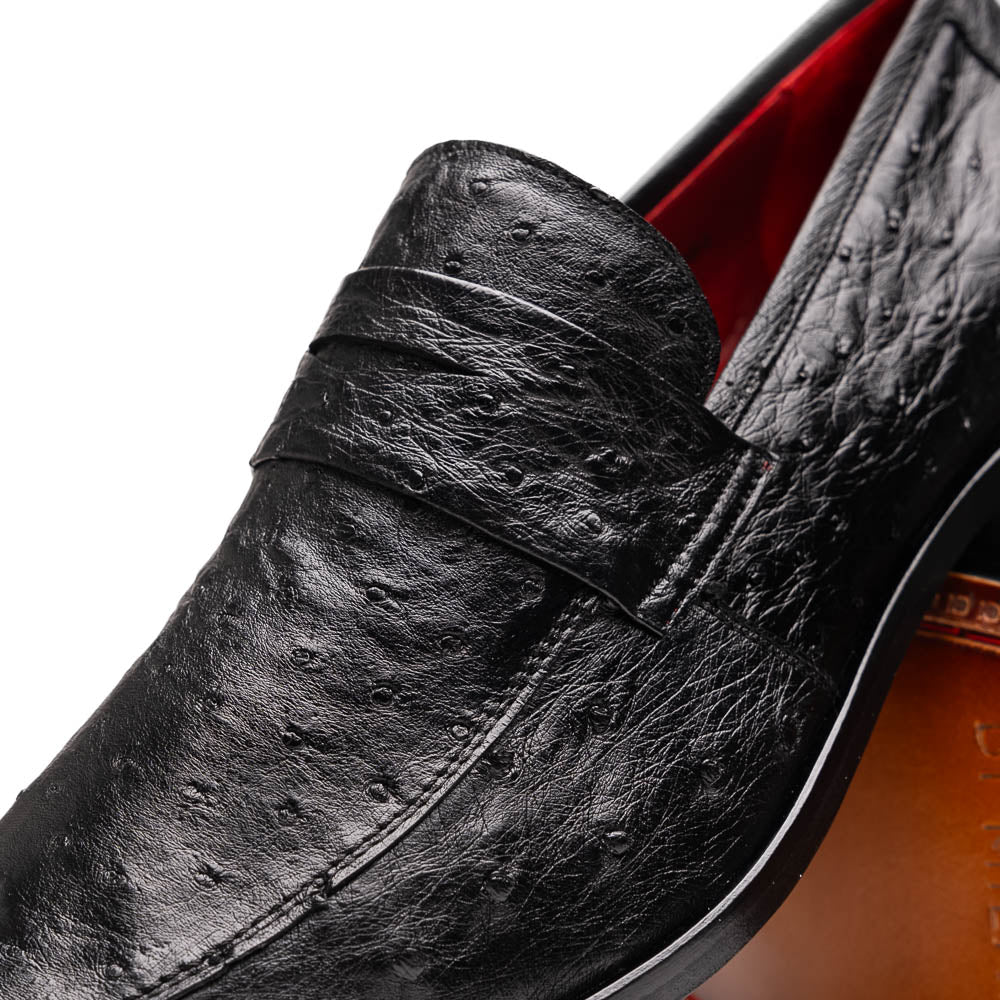 The Salvatore Black by Marco Di Milano is a pair of genuine ostrich leather loafers in black with a brown leather sole, detailed stitching, and an embossed brand logo on the outsole—ideal for luxury footwear enthusiasts.