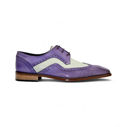 The Duca Di Matiste Duca Saranno Lavender/Panna is an Italian-made two-tone dress shoe in purple and white leather, with decorative perforations and a wooden sole, shown in a side view.