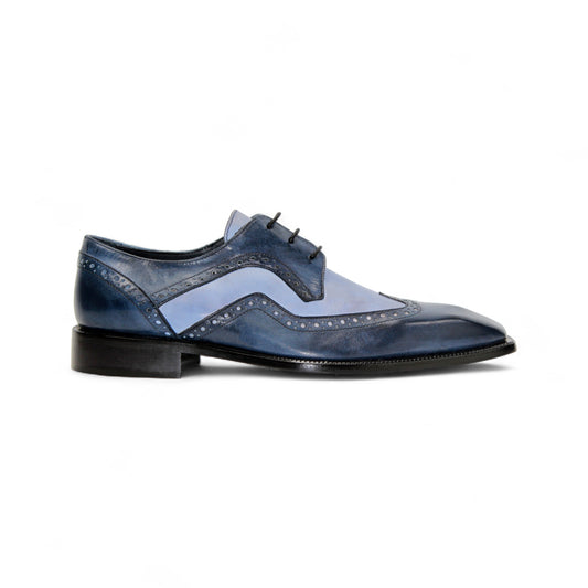 The Duca Di Matiste Duca Saranno Navy/Light Blue men’s dress shoe features genuine leather in blue tones, decorative stitching, perforated accents, and a black sole, displayed in profile on a white background.