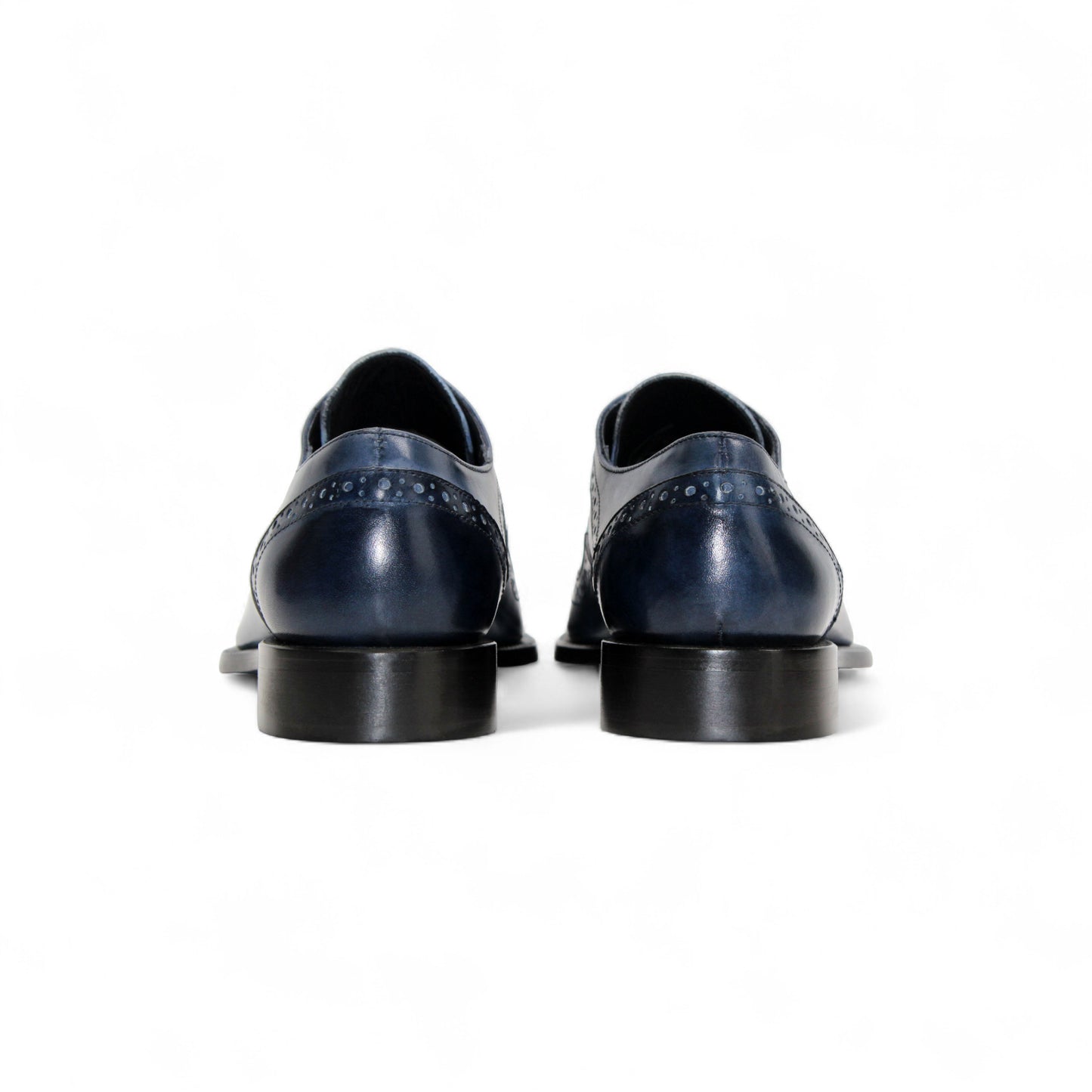 The Duca Di Matiste Duca Saranno Navy/Light Blue men’s dress shoe features genuine leather in blue tones, decorative stitching, perforated accents, and a black sole, displayed in profile on a white background.