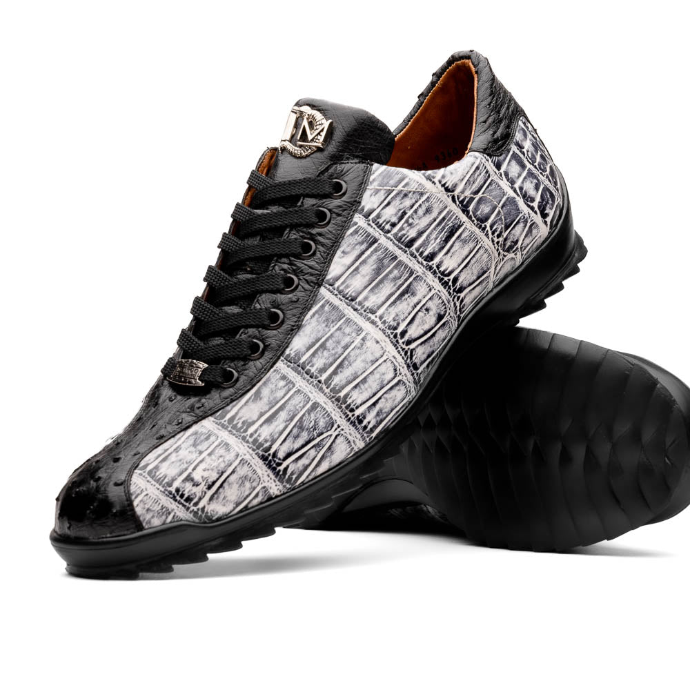 The Saulo Newspaper / Black sneakers by Marco Di Milano are luxury men's shoes featuring a black and white crocodile pattern, black laces, and a textured sole, showcased on a white background.