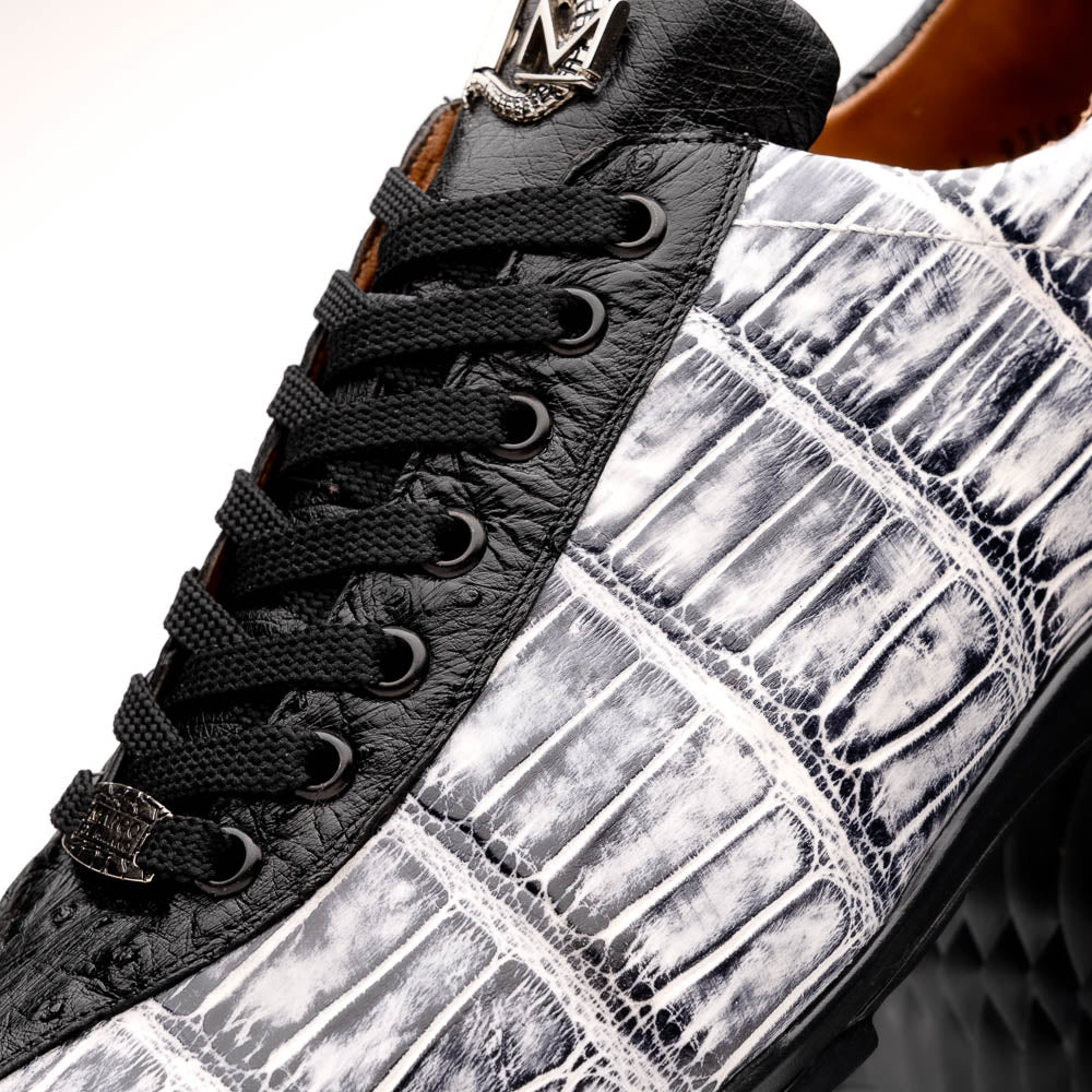 The Saulo Newspaper / Black sneakers by Marco Di Milano are luxury men's shoes featuring a black and white crocodile pattern, black laces, and a textured sole, showcased on a white background.