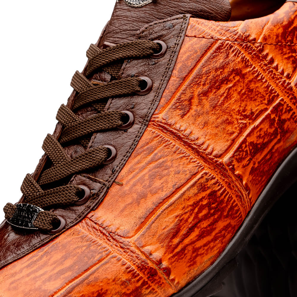 The Saulo Brandy / Brown sneakers by Marco Di Milano feature genuine brown alligator, black soles, dark brown laces, and metallic logo accents—luxury men's footwear displayed against a white background.