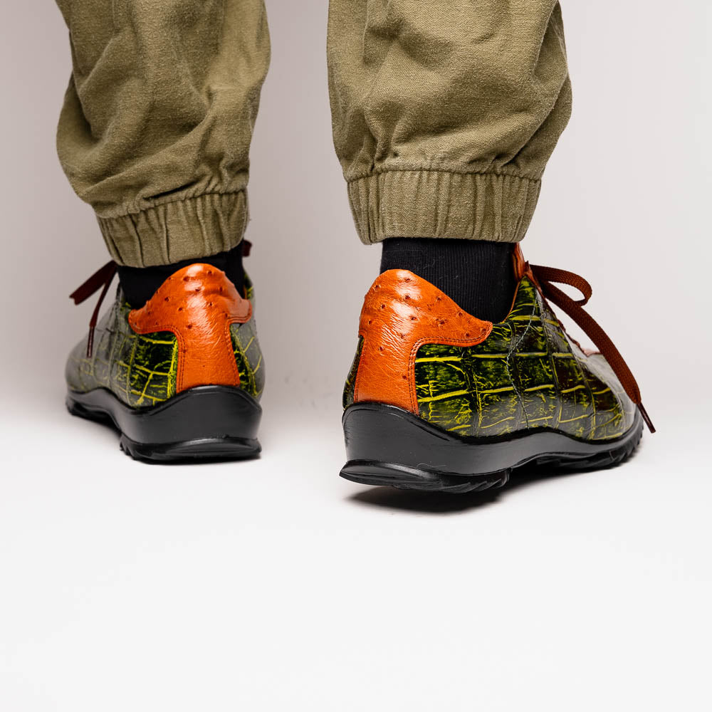 The Saulo Green / Cognac by Marco Di Milano is a luxury men's sneaker with an orange and green crocodile pattern, brown laces, black sole, and metallic tongue emblem—ideal for those wanting an authentic alligator look.