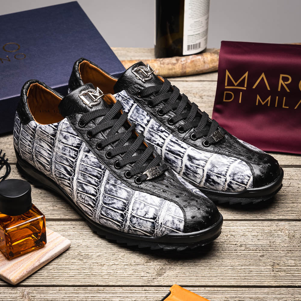 The Saulo Newspaper / Black sneakers by Marco Di Milano are luxury men's shoes featuring a black and white crocodile pattern, black laces, and a textured sole, showcased on a white background.