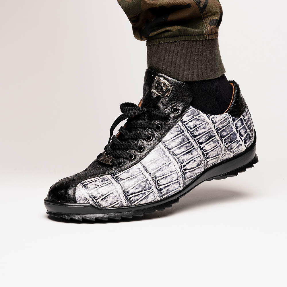 The Saulo Newspaper / Black sneakers by Marco Di Milano are luxury men's shoes featuring a black and white crocodile pattern, black laces, and a textured sole, showcased on a white background.