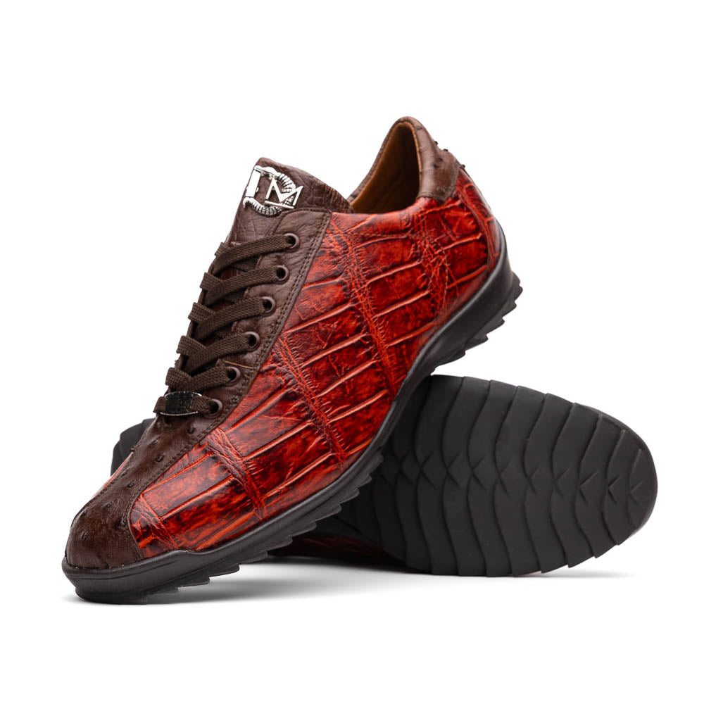 The Saulo Cognac sneakers by Marco Di Milano feature genuine alligator leather in red and brown with black laces and soles—an exceptional luxury men's footwear choice, shown with one upright and the other lying on its side.
