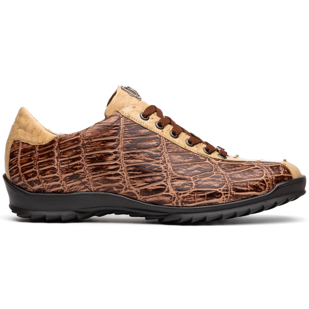 A pair of Saulo Orix men's shoes by Marco Di Milano, featuring brown crocodile-pattern leather and black rubber soles; one shoe stands upright while the other leans against it.