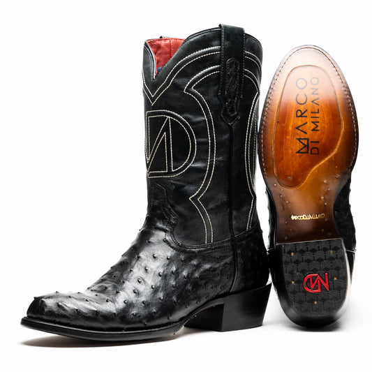 A pair of handcrafted Savannah Black western boots by Marco Di Milano; one boot stands upright while the other lies on its side, displaying a branded sole with "Marco Di Milano.