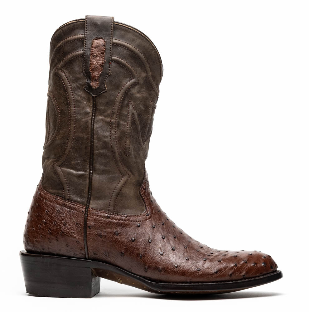 A pair of Marco Di Milano Savannah Kango Tabac boots in brown full-quill ostrich leather, one upright and the other on its side revealing the sole with the "Marco Di Milano" logo.