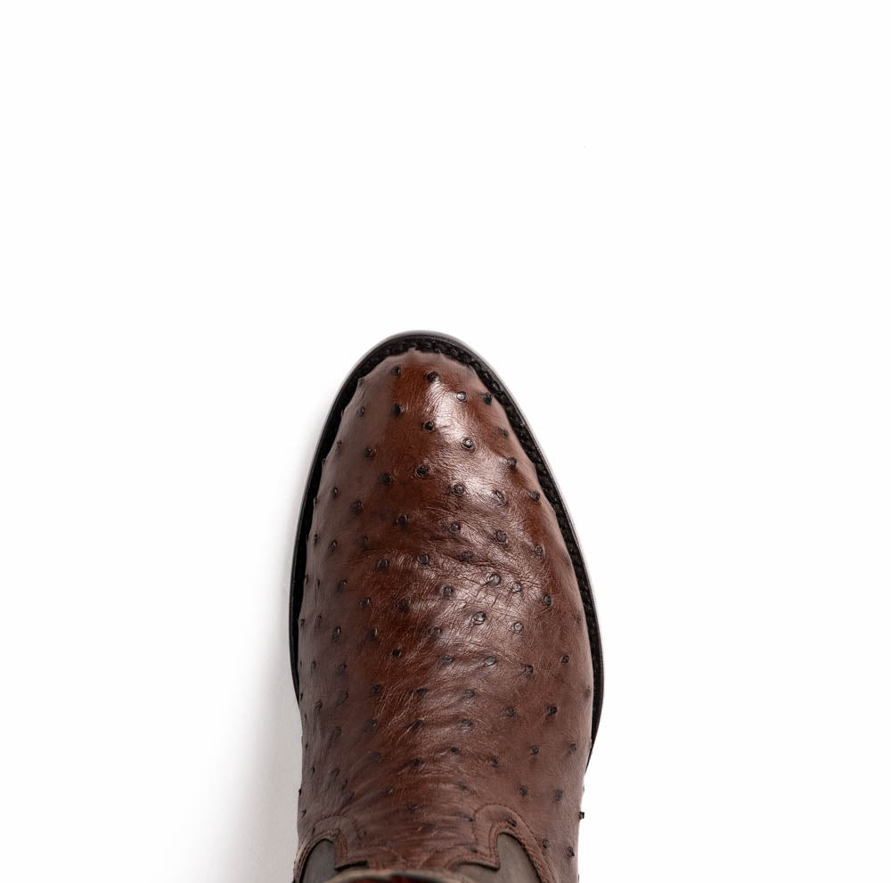 A pair of Marco Di Milano Savannah Kango Tabac boots in brown full-quill ostrich leather, one upright and the other on its side revealing the sole with the "Marco Di Milano" logo.