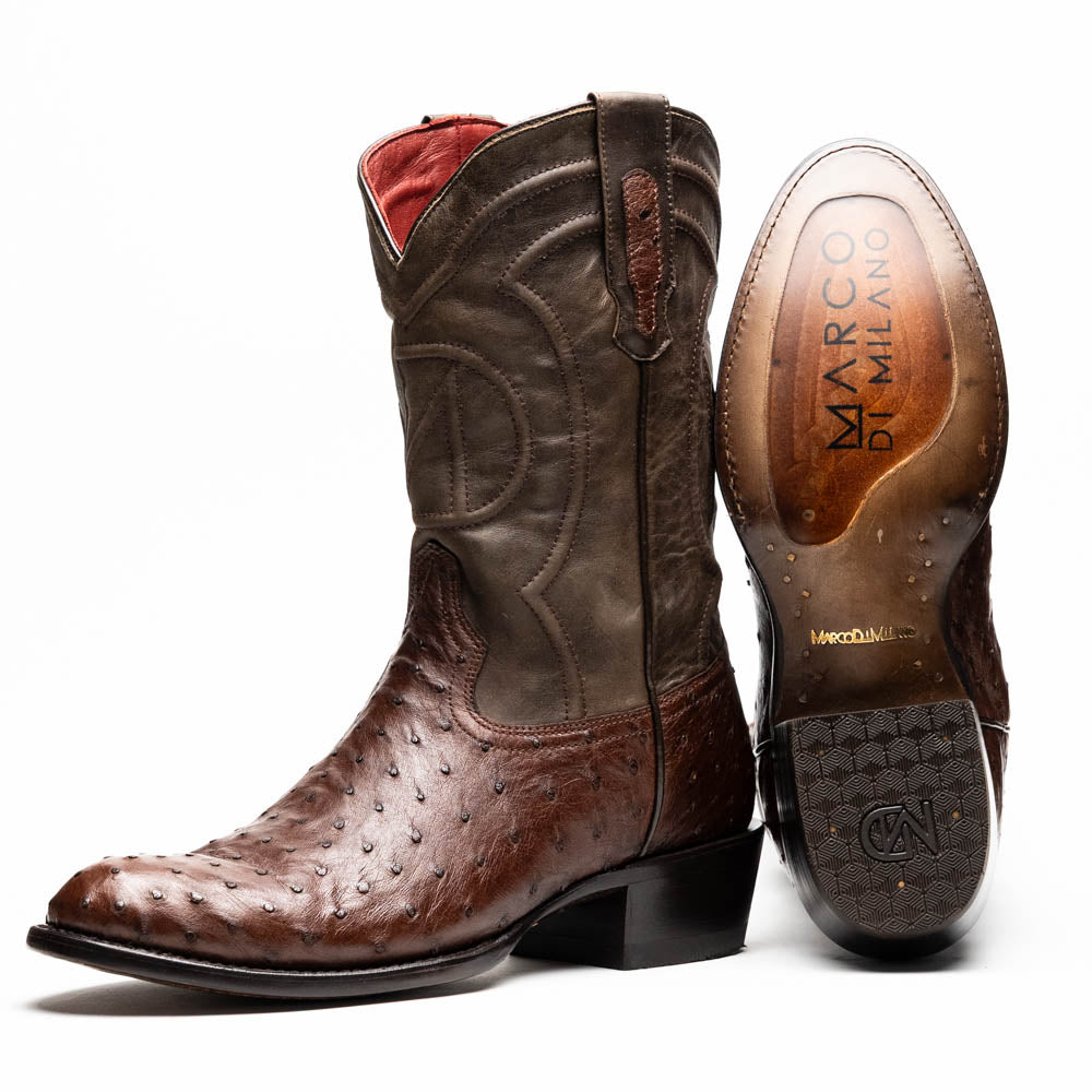 A pair of Marco Di Milano Savannah Kango Tabac boots in brown full-quill ostrich leather, one upright and the other on its side revealing the sole with the "Marco Di Milano" logo.