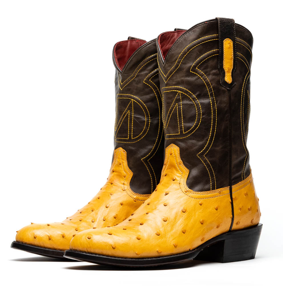 Savannah Buttercup by Marco Di Milano: two-tone Western cowboy boots featuring yellow genuine ostrich leather foot, dark brown leather shaft, yellow stitching, and branded sole.