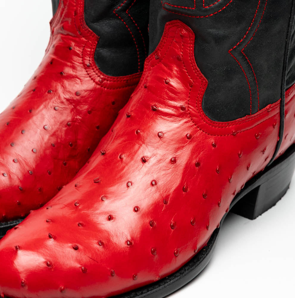 The Savannah Red by Marco Di Milano is a handcrafted western boot with red genuine full-quill ostrich leather, a black upper shaft accented with red stitching, and the Marco Di Milano logo featured on the sole.