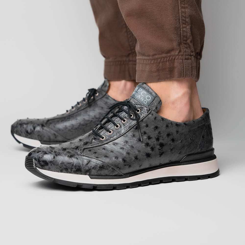The Marco Di Milano Scanno Antique Gray sneakers feature genuine ostrich quill leather with a hand painted finish, black leather accents, white midsoles, and black rubber outsoles, displayed against a plain white background.