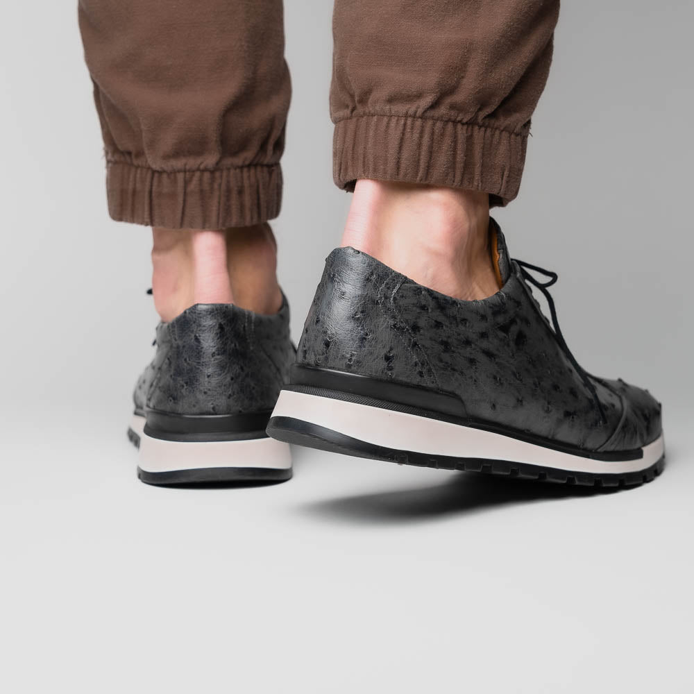 The Marco Di Milano Scanno Antique Gray sneakers feature genuine ostrich quill leather with a hand painted finish, black leather accents, white midsoles, and black rubber outsoles, displayed against a plain white background.
