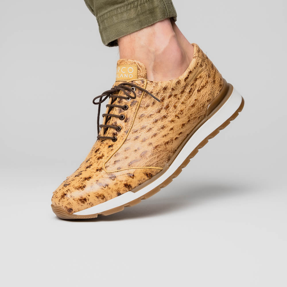 The Scanno Antique Orix by Marco Di Milano is a pair of tan, textured lace-up casual shoes with a hand-painted finish and brown rubber soles, shown against a white background—ideal for luxury footwear enthusiasts.