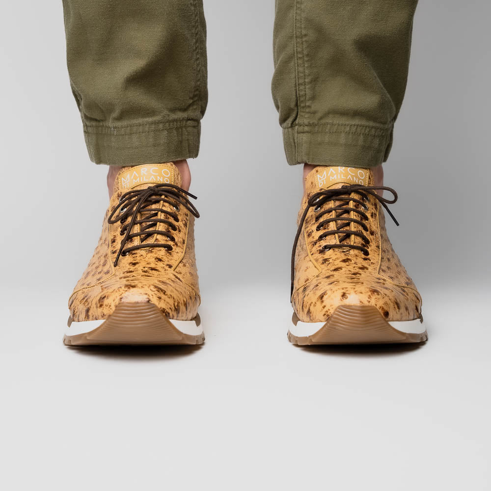 The Scanno Antique Orix by Marco Di Milano is a pair of tan, textured lace-up casual shoes with a hand-painted finish and brown rubber soles, shown against a white background—ideal for luxury footwear enthusiasts.