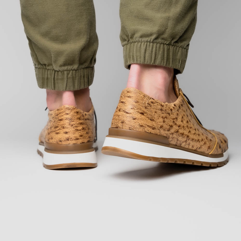 The Scanno Antique Orix by Marco Di Milano is a pair of tan, textured lace-up casual shoes with a hand-painted finish and brown rubber soles, shown against a white background—ideal for luxury footwear enthusiasts.