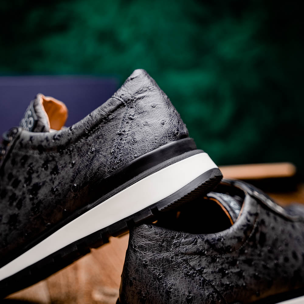 The Marco Di Milano Scanno Antique Gray sneakers feature genuine ostrich quill leather with a hand painted finish, black leather accents, white midsoles, and black rubber outsoles, displayed against a plain white background.