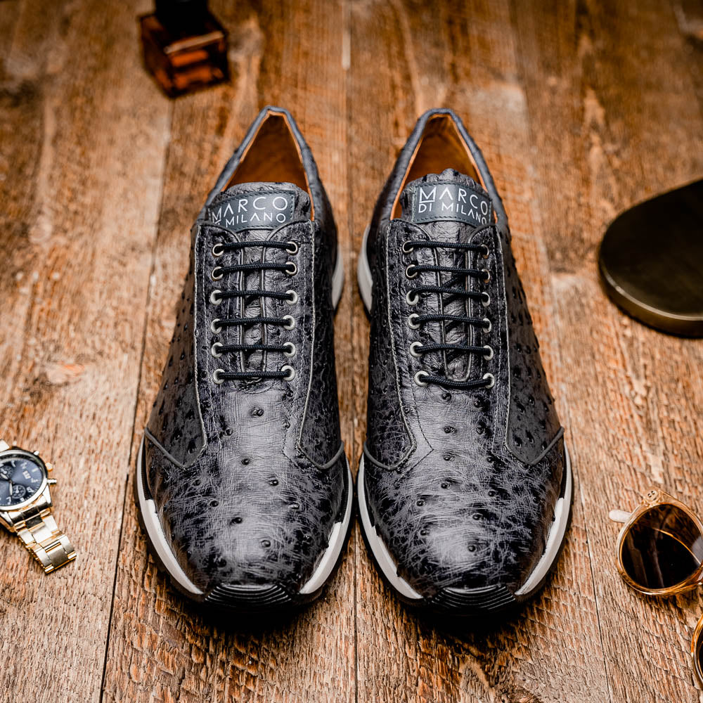 The Marco Di Milano Scanno Antique Gray sneakers feature genuine ostrich quill leather with a hand painted finish, black leather accents, white midsoles, and black rubber outsoles, displayed against a plain white background.