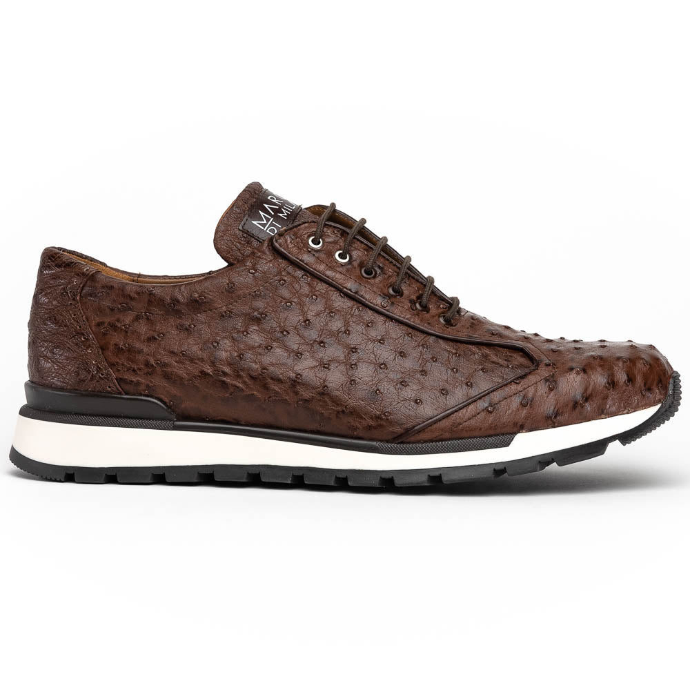 The Scanno Antique Brown sneaker by Marco Di Milano features genuine ostrich quill leather in brown, black laces, and a white-and-black rubber sole. One shoe stands upright while the other rests on its side, highlighting the hand-painted finish.