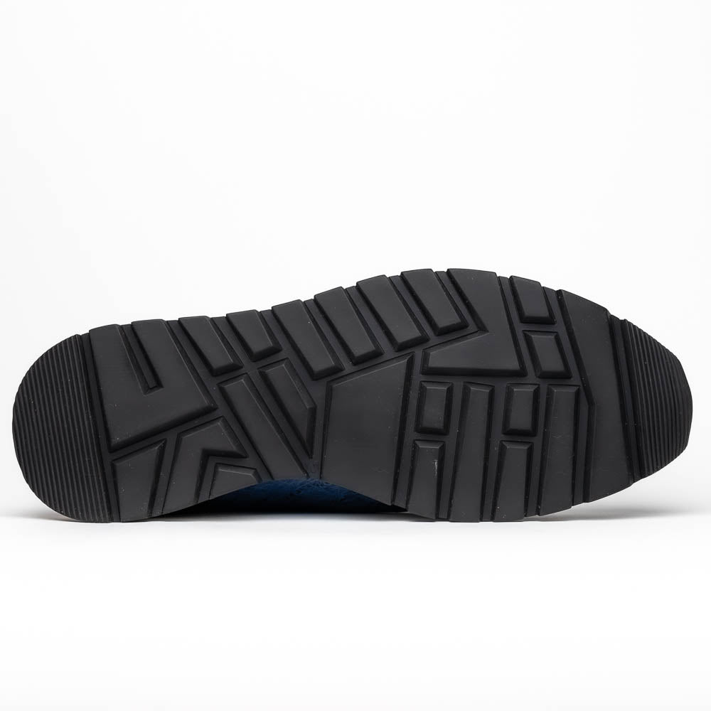 The Marco Di Milano Scanno Antique Navy sneaker features genuine ostrich quill leather in blue, black laces, a white and black rubber sole, and textured details—luxury footwear displayed on a white background.