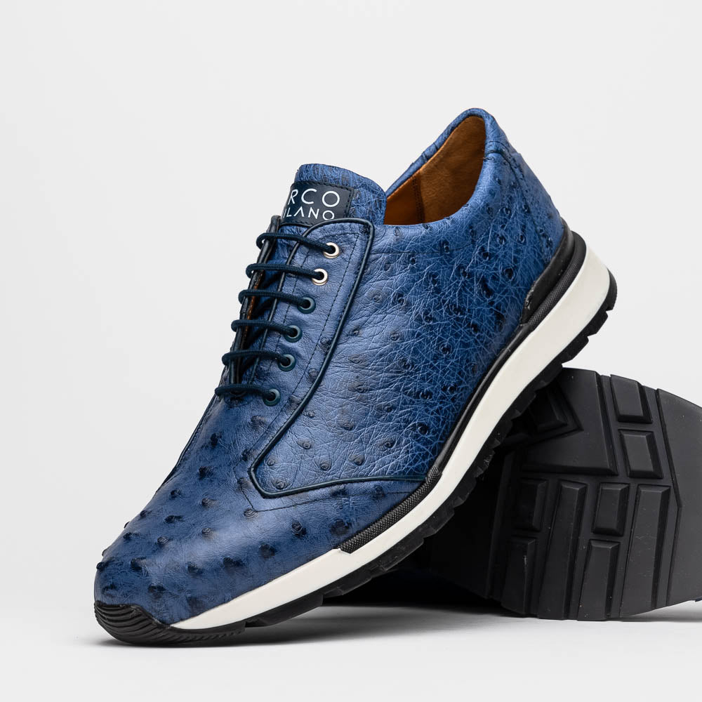 The Marco Di Milano Scanno Antique Navy sneaker features genuine ostrich quill leather in blue, black laces, a white and black rubber sole, and textured details—luxury footwear displayed on a white background.